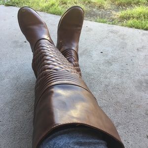 Very well worn knee length boots